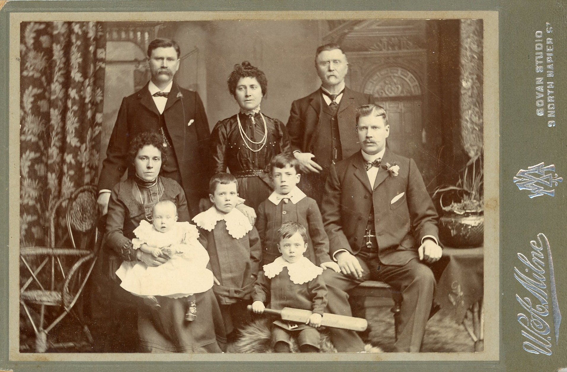 Photo of photos/John Logan Sr & family Taken in Glasgow Scotland, in 1902 when three cousins visited. Evan, Joan, and John McLennan in back row.